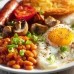 Components of a full English breakfast including eggs, bacon, beans, and toast.